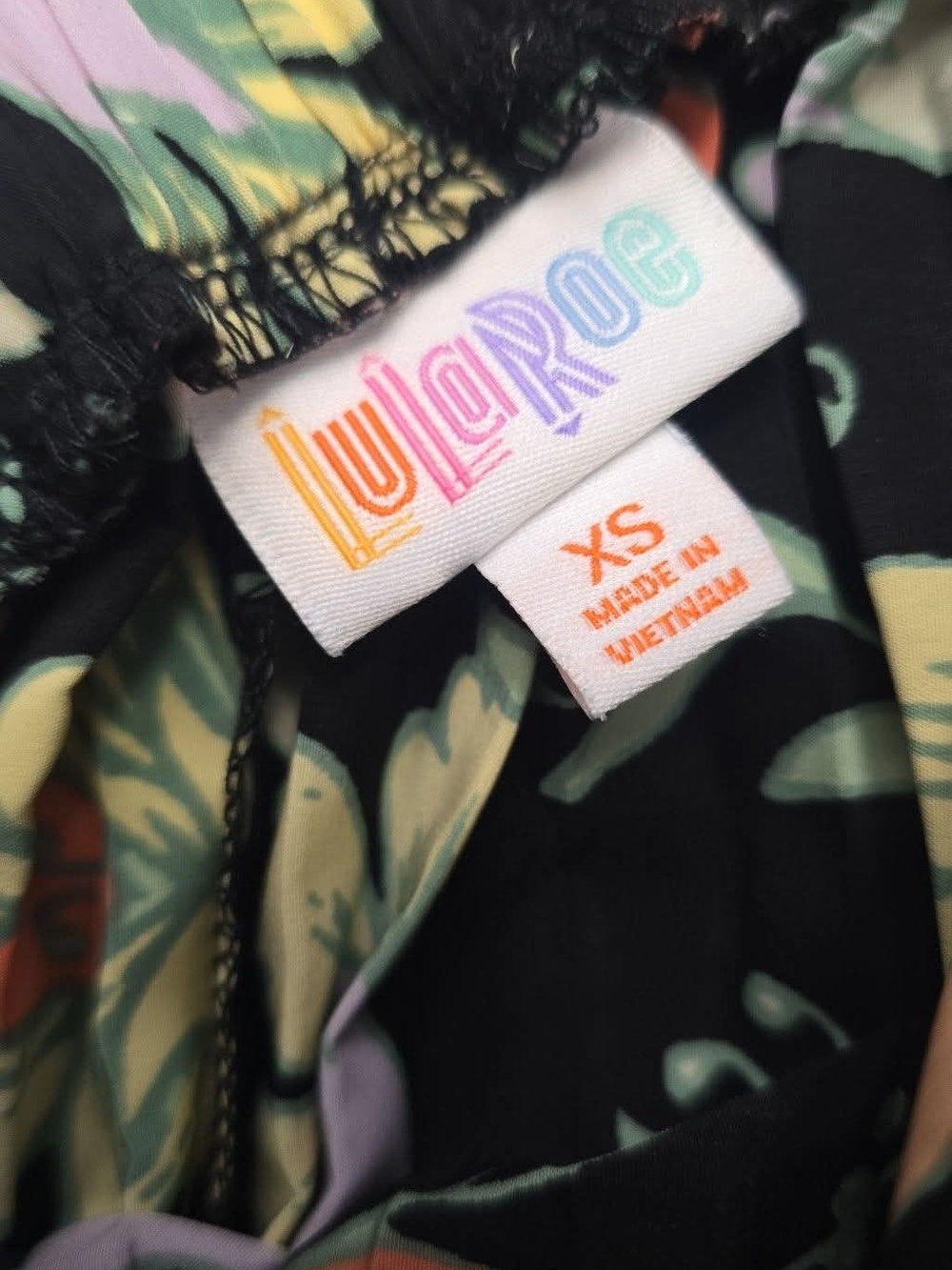 LuLaRoe Black Floral Print Top with Pastel Accents - Picture 2 of 2